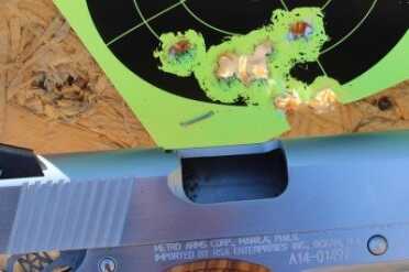 Tighter group from a different shooter. There was a stick on dot where the rounds are touching.