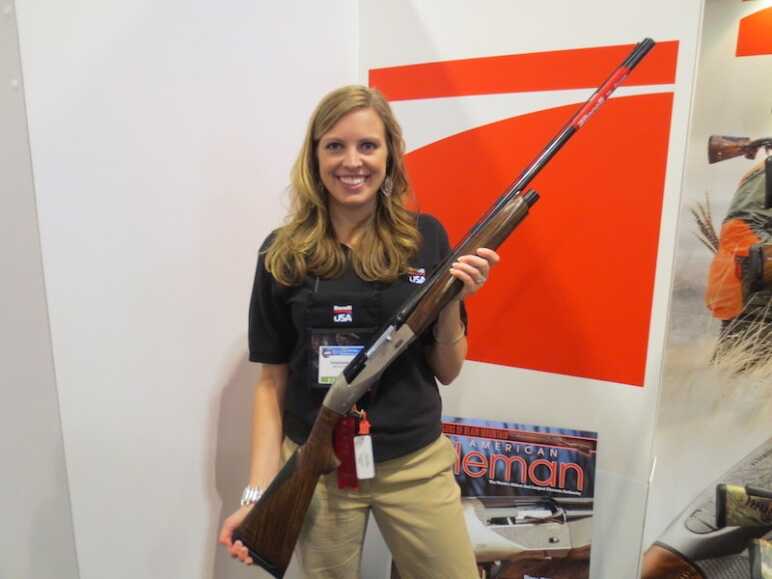 Photo Essay: The NRA Annual Meetings & Exhibits in 20 Pictures Benelli Social Media Director showing off one of her favorites.