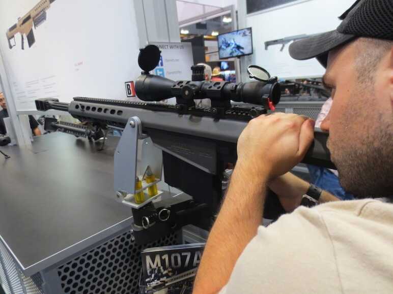 Photo Essay: The NRA Annual Meetings & Exhibits in 20 Pictures Jacob having some fun, pretending to be a gunner on a chopper. "Get to the chopper!"