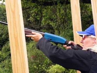 why Sporting Clays is one of America’s fastest growing sports. Rita takes a shot at a quartering bird moving away.