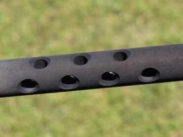 Gas vents though this ported gas-tube type extension on the chamber.