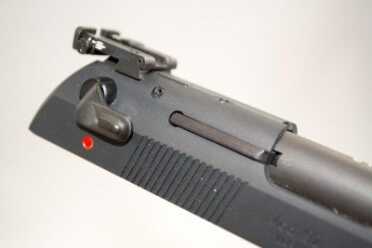 Review: Beretta 92 .22LR Practice Kit Conversion The safety is ambidextrous. Note the external extractor.