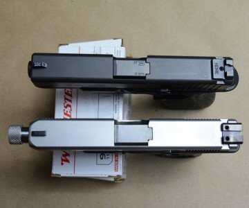 Timberwolf and a GLOCK 19. The GLOCK is wearing black. 