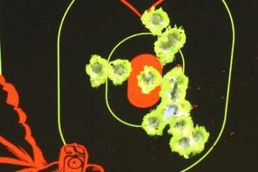 Even without the extra serrations and checkering, the pistol is easy to control. This is fast fire from 10 yards. 