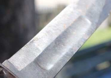 Some think the fuller is a weight reduction, but it doesn't remove much metal. The fullers do appear to be ground out, though--which is odd for a war-time piece as it wastes steel and requires more work.