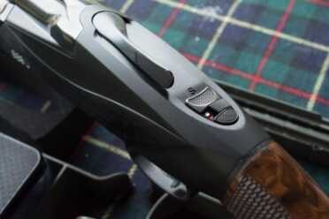Benelli 828U--The Future of the Over-Under Shotgun The opening lever is deliberately offset to be closer to your thumb.