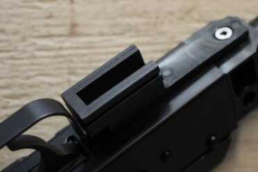 This section of rail guides the grip/stock combo's travel.