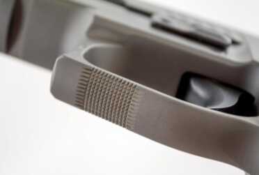 Checking has been added to the bottom of the trigger guard to help keep the support hand in place.