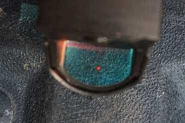 One glowing red dot is easier to see than three white dots. 