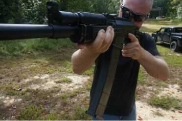 The long magazine holds more, but it requires a bit of practice. It is easy to see how it can limit range of motion.