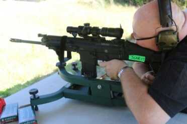 We tried three different shooting rests, four scopes, and at least 30 different .308 loads. Our best groups came in at 2 inches from 100 yards. 