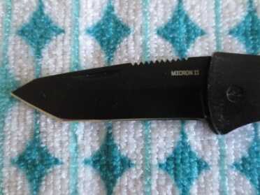 A shot of the tanto-style blade.  Note the jimping on the spine to improve grip.  