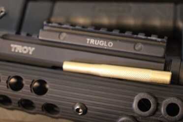 If it doesn't slide in place, you may need to find a way to hammer it home. I used a brass punch and a Tru-Glo sight riser.