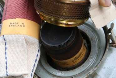 Prepping 101: Off Grid Heating With Diesel and Oil The only removable parts on the Aladdin are the burner ring and that cap in the middle. The wick pushes down over the center draft cylinder, like the Perfection.