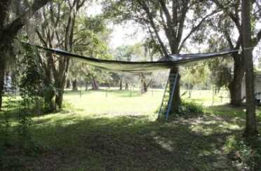 I think a black tarp is your best bet because it will naturally be hidden from overflying aircraft. 