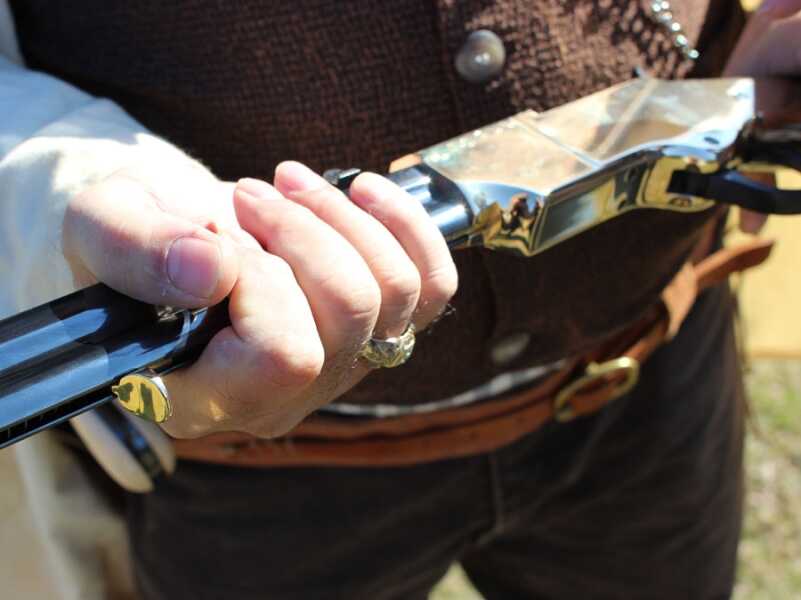 The Henry Original--New Old Gun Review If you look closely at the support hand, you will see the loading spring's brass tab. As it slides down the tube, you have to let it move by.