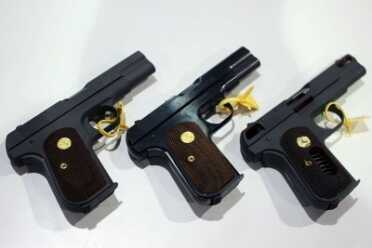 Three models of the 1903: blued, parkerized, and cutaway.