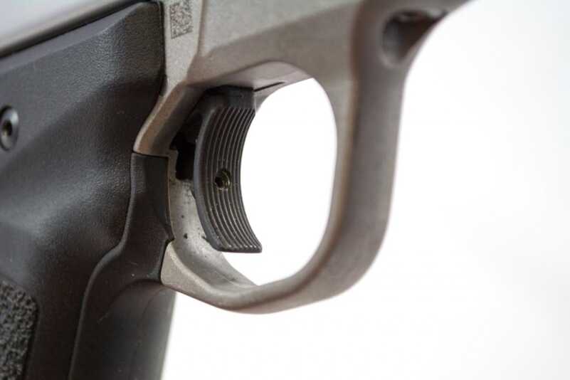 We Shoot the New Smith & Wesson Victory .22 LR Pistol Note the overtravel adjustment screw in the trigger face.