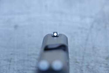 Front Sight is steel that is attached with a screw from the bottom of the slide.