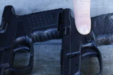 The magazine button is textured and easy to reach. It is protected from accidental activation by a swell in the grip.