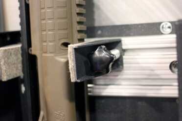 Inside of the second generation, there's a track system with sliding panels that will hold guns securely.