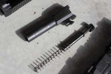 One captured spring inside the more traditional recoil spring. 