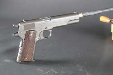This gun had been in service with the Argentinian Navy, and had been parkerized. There was no original finish left.