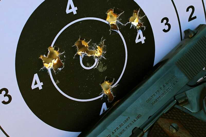This is my handiwork from 15 yards. Not the greatest display of marksmanship, but the target was bouncing on its cables because of the stiff wind. 