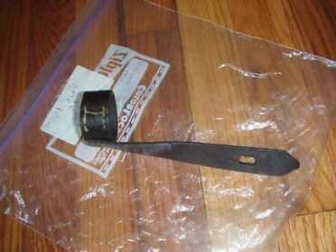 Leather safety strap to hold bolt closed and keep gun clean.