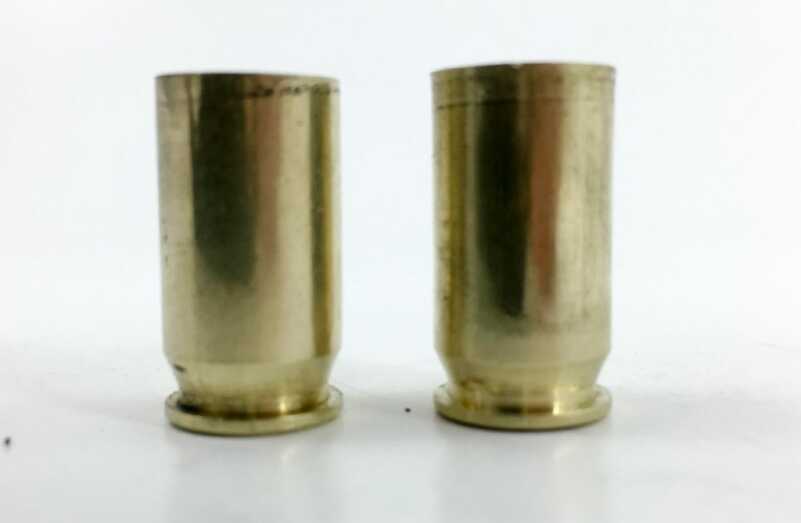 If you look carefully, you can see that the case on the right has a very slight expansion right at the mouth. It's already been through the case mouth expansion die.