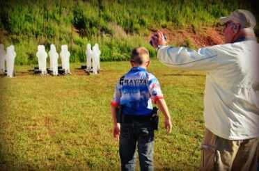10-year-old Andrew Yackley prepares for a steel stage at the 2014 USPSA Area 5 Championship.