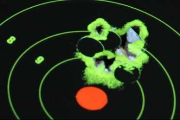 Working fast, I had a hard time bringing the shots down. There are at least 20 rounds in this one group--all shot double action and fast from 7 yards. 