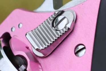 Push in to release the catch. 