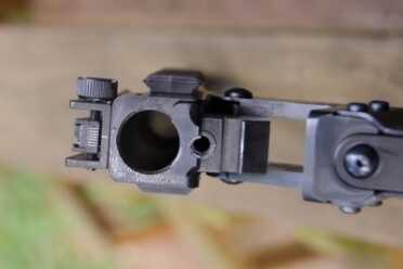 The break action, opened wide. That .22 barrel looks really small in comparison.