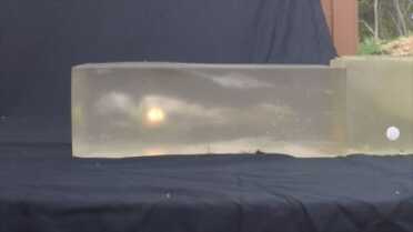 Flame from Winchester 223 caused by burning gases and pressure change from block collapsing on temporary one cavity