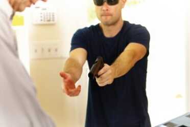 Ep. 5 Should I Shoot? What If the Crook has a Gun Pointed at the Clerk? A robber enters a store and demands money from the cash register while pointing a gun at the store employee.