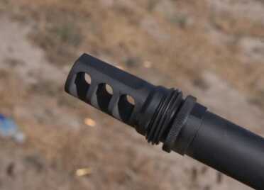 DRD Tactical Takedown Kivaari Semi-Auto .338 Lapua Magnum The threaded muzzle is topped off with a SilencerCo Harvester Big Bore .338 muzzle brake.