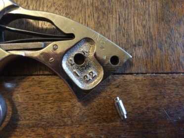 Replacing Your Revolver Grips with Hogue Exotic Hardwood! A close up after it's been removed.