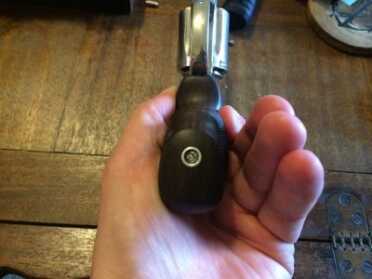 Replacing Your Revolver Grips with Hogue Exotic Hardwood! Once it's fully seated, you can tighten the screw.