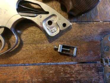 Replacing Your Revolver Grips with Hogue Exotic Hardwood! The stirrup with the stirrup pin.