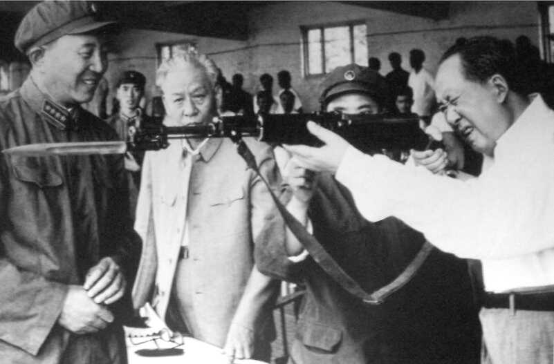 Mao Zedong and Liu Shaqui examine an SKS Carbine taken from the factory assembly line.