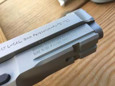 A Picatinny rail allows attachment of lights or lasers. This is a difference from the pre-A1 series models. 