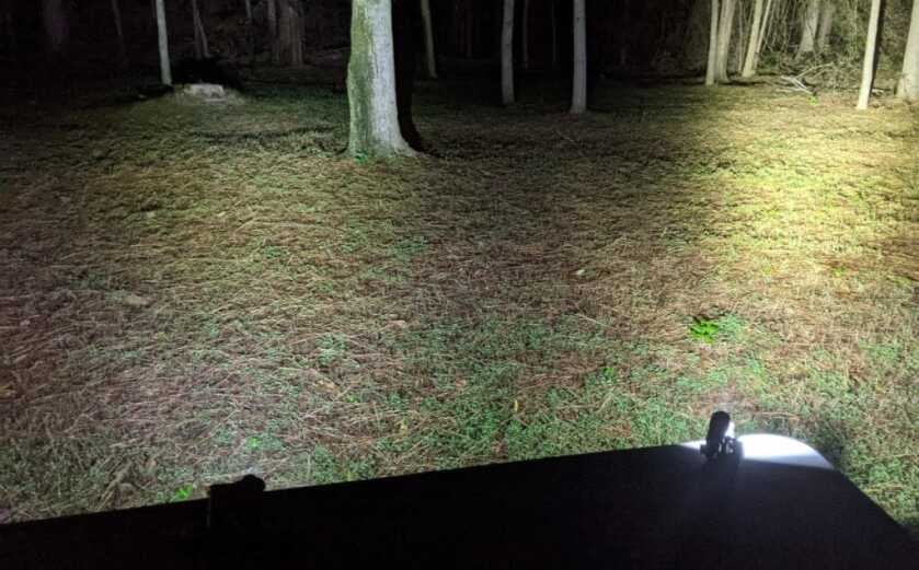 Crimson trace lights showing how beam  angle affects light throw