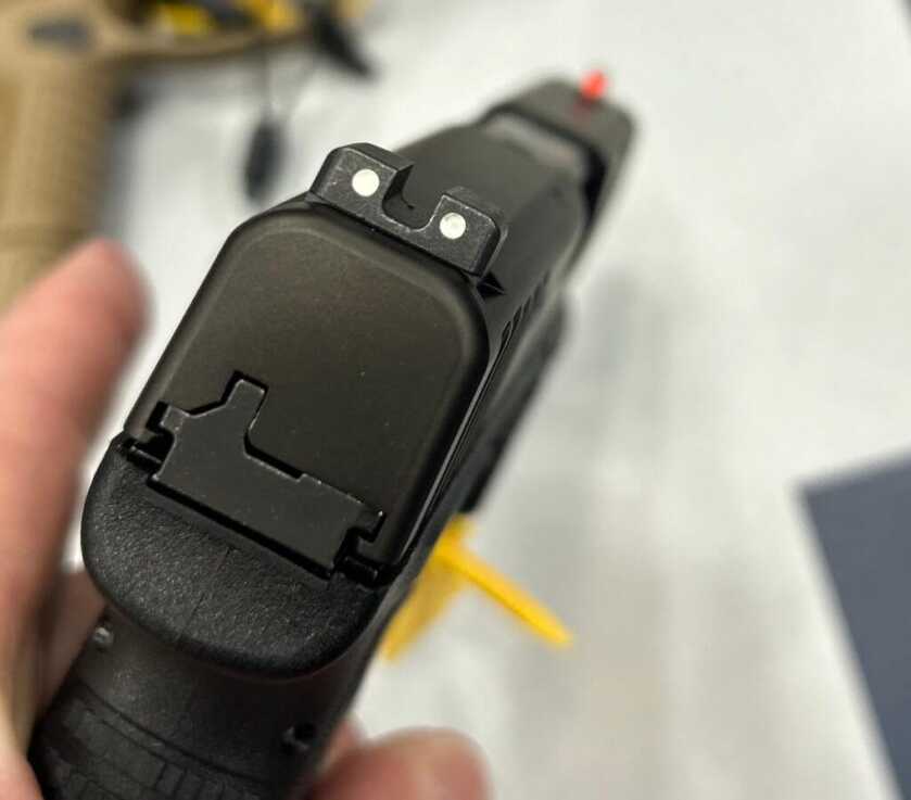 The three-dot iron sights with tritium front sight.