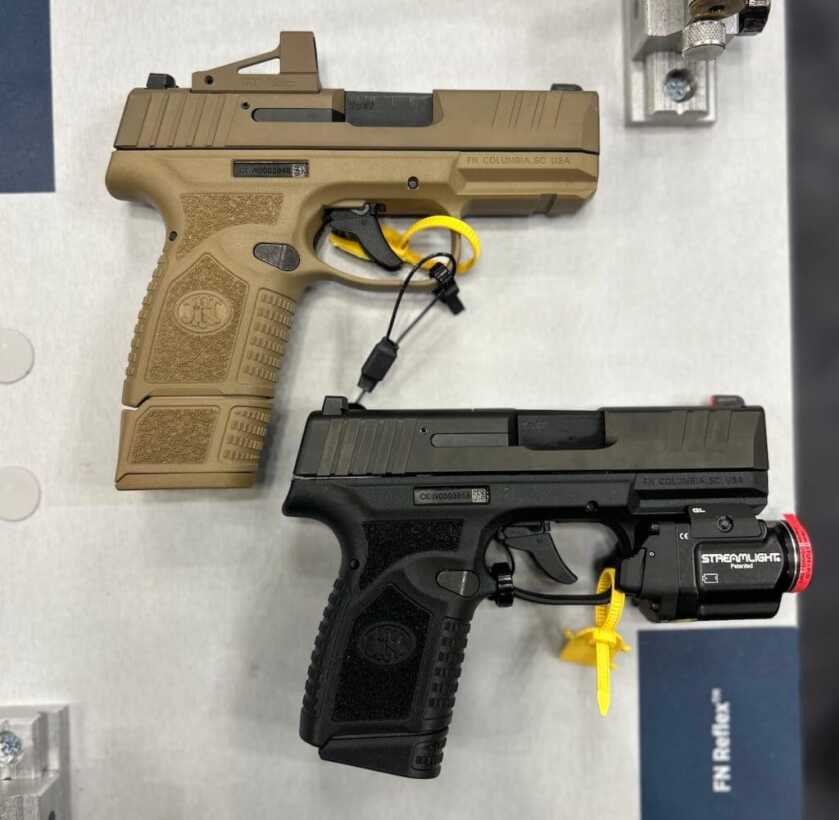 The two FN Reflex models, black and FDE.