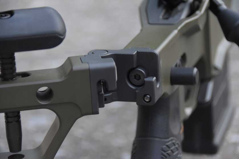 A closeup of the folding hinge on the Delta 5 Pro while the stock is in the half-folded position.