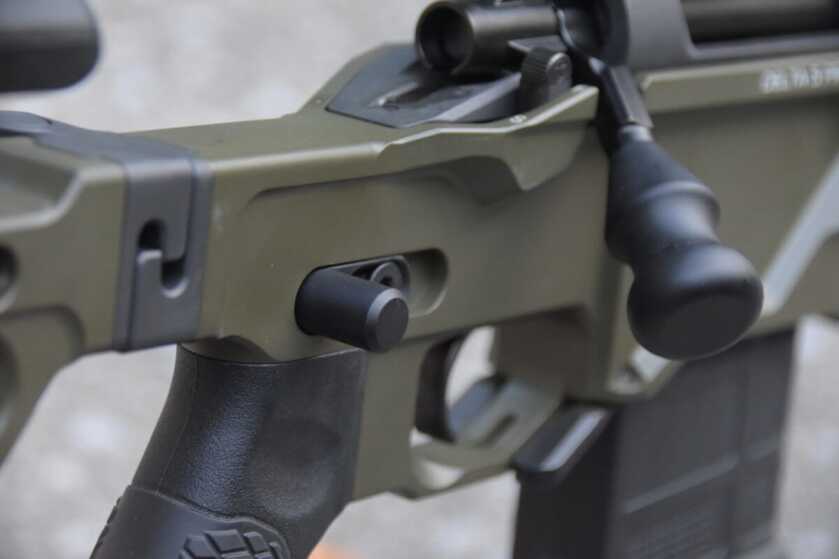 The thumb stop on this rifle is located on the right side, but is swappable to the left side.