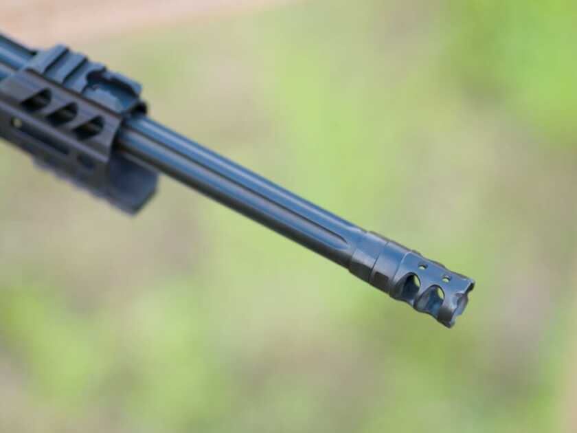 POF Tombstone 9mm showing the end of the fluted barrel and the muzzle brake with dual top ports.