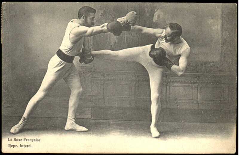 vintage photo of two men fighting savate style martial arts