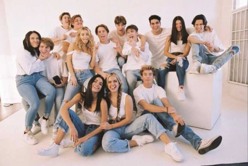 image of young adults in white shirts and jeans making faces